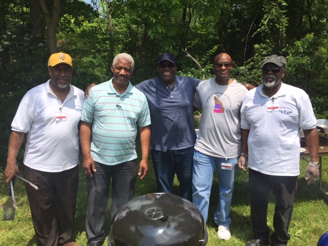 Men working together to provide for youth